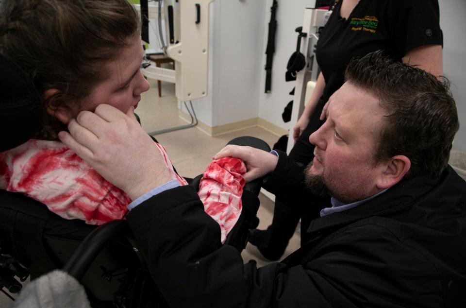 Bryan DeHart checks in with his daughter Savanah DeHart, 15, during her rehabilitation at the Mary Free Bed Rehabilitation Hospital in Grand Rapids Thursday, Jan. 23, 2020 to treat the debilitating effects of the Triple E virus. DeHart was likely bitten by a an infected mosquito last summer and suffered stroke-like symptoms.