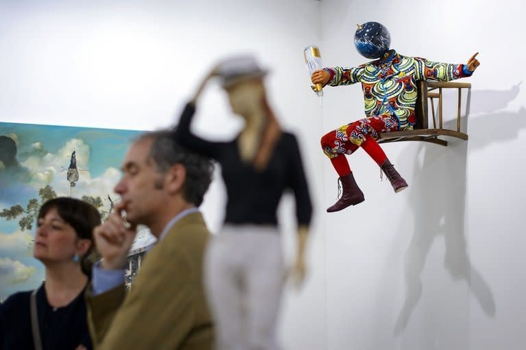 Yinka Shonibare's sculpture "Champagne Kid (Perching)" is pictured at an Art Basel preview on June 11, 2013. Collectors from around the world have flocked to Switzerland this week for Art Basel, the biggest contemporary art fair on the planet