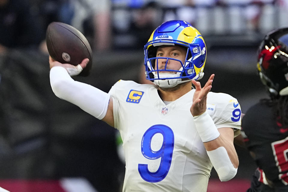 Los Angeles Rams quarterback Matthew Stafford throws a pass during the first half of an NFL football game against the Arizona Cardinals, Sunday, Nov. 26, 2023, in Glendale, Ariz. (AP Photo/Matt York)