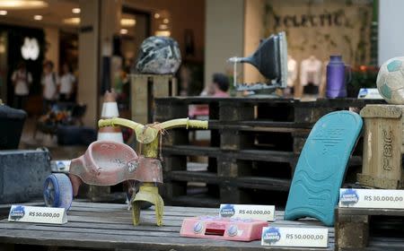 Toys collected in the Guanabara Bay are pictured in the exhibition Achados da Guanabara, or Found in Guanabara, at the Leblon mall in Rio de Janeiro March 24, 2015. REUTERS/Sergio Moraes