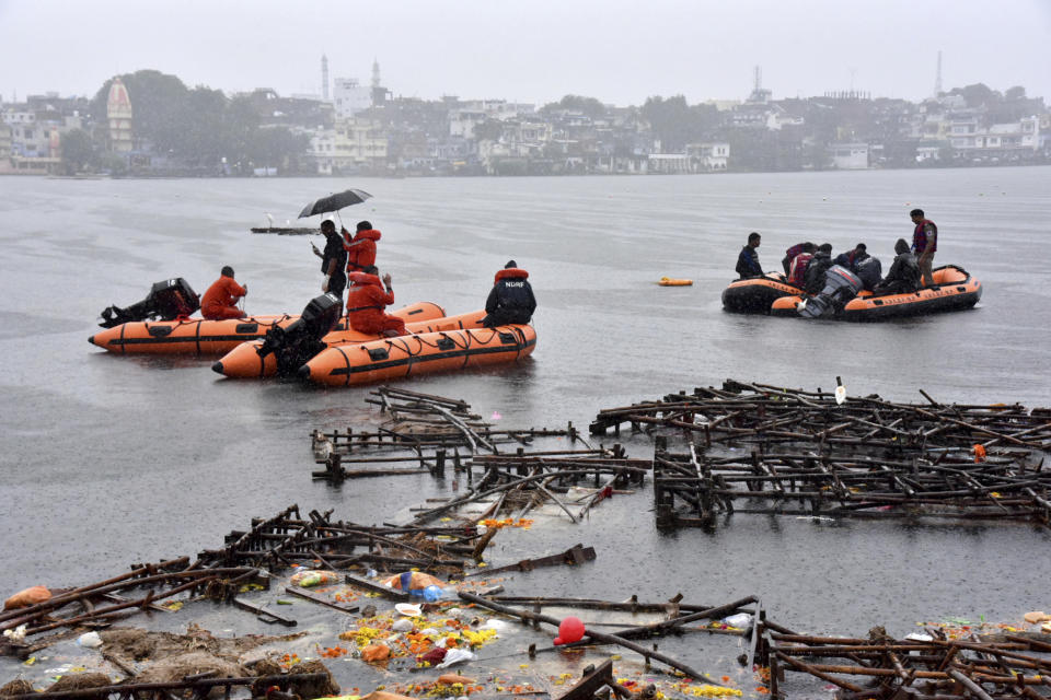 Rescuers conduct search operation on a lake in Bhopal, in the central Indian state for Madhya Pradesh, Friday, Sept. 13, 2019. Police say Hindu worshippers drowned when their boat capsized during a religious celebration on the lake. (AP Photo)