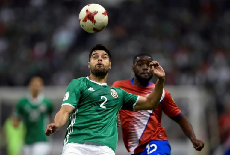 Javier Hernandez and Nestor Araujo (front) scored for Mexico as they moved to the top of the 2018 World Cup qualification standings with a 2-0 defeat of Costa Rica