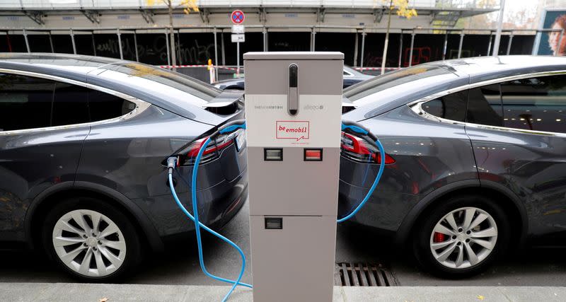 FILE PHOTO: Tesla Model X electric cars recharge their batteries in Berlin