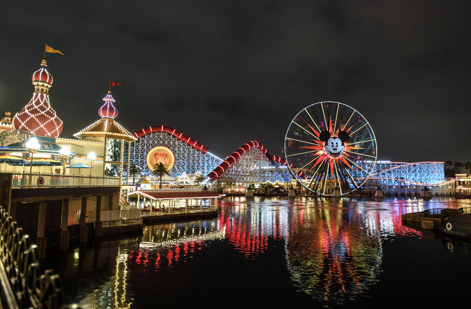 Evening view of California Adventure with Pixar Pier rides illuminated