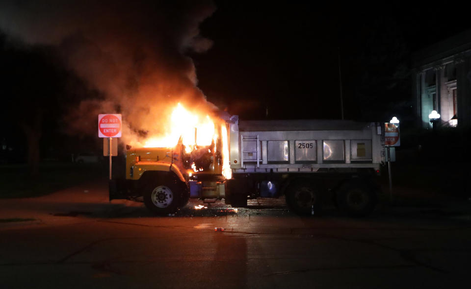 Aug 23, 2020; Kenosha, WI, USA; A city truck burns outside the Kenosha County Courthouse in Kenosha on Sunday, Aug. 23, 2020. Kenosha police shot a man Sunday evening, setting off unrest in the city after a video appeared to show the officer firing several shots at close range into the man's back. Mandatory Credit: Mike De Sisti/Milwaukee Journal Sentinel via USA TODAY NETWORK/Sipa USA