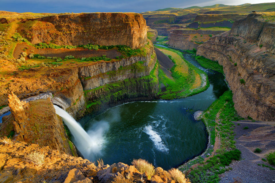 <p>The sun sets over Palouse Falls, plunging into deep canyon at Palouse Falls State Park in LaCrosse, Wash. (Photo: Anna Gorin/Moment RM/Getty Images) </p>