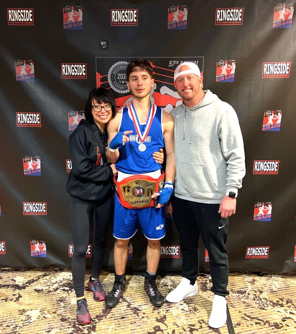 Peoria resident Isaiah Ghantous celebrates his Silver Gloves boxing national championship in the 154-pound weight class on Feb. 3, 2024 in Independence, Mo., with his mother, Jennifer Lamar, and father-figure, John Hinkle.
