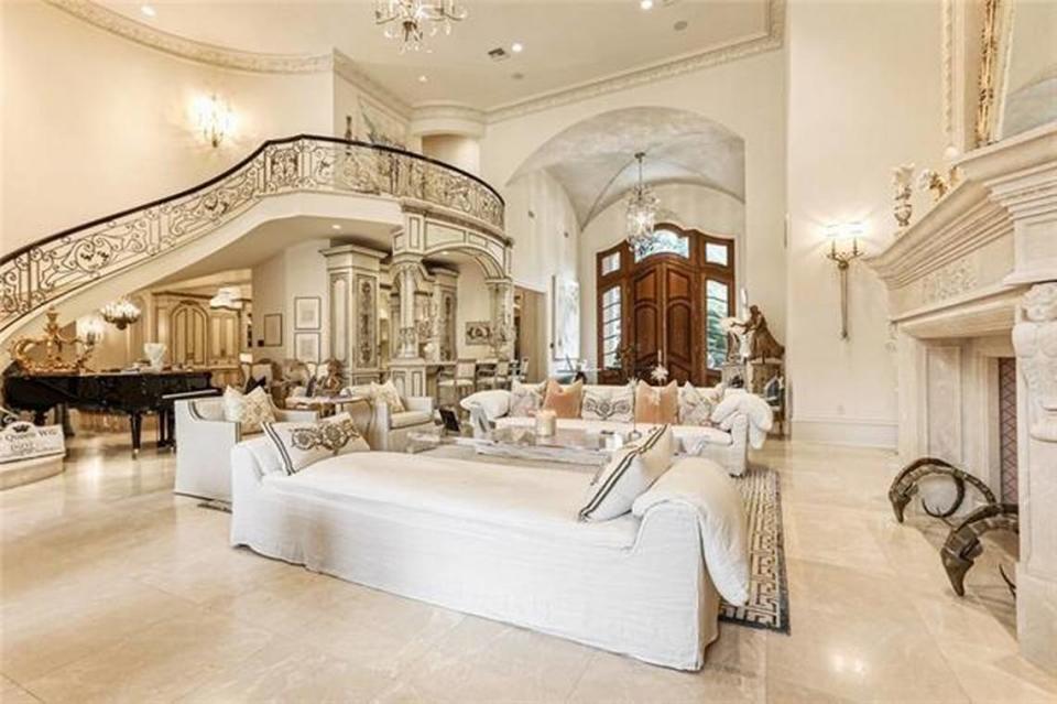 The home boasts several high-end touches throughout, including antique European fixtures, custom cabinetry, lofty 24-foot ceilings in the foyer and heated marble floors.