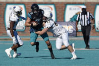 Coastal Carolina quarterback Grayson McCall (10) scrambles as Appalachian State's Caleb Spurlin (97) and Nick Hampton close in during the first half of an NCAA college football game Saturday, Nov. 21, 2020, in Conway, S.C. (AP Photo/Richard Shiro)