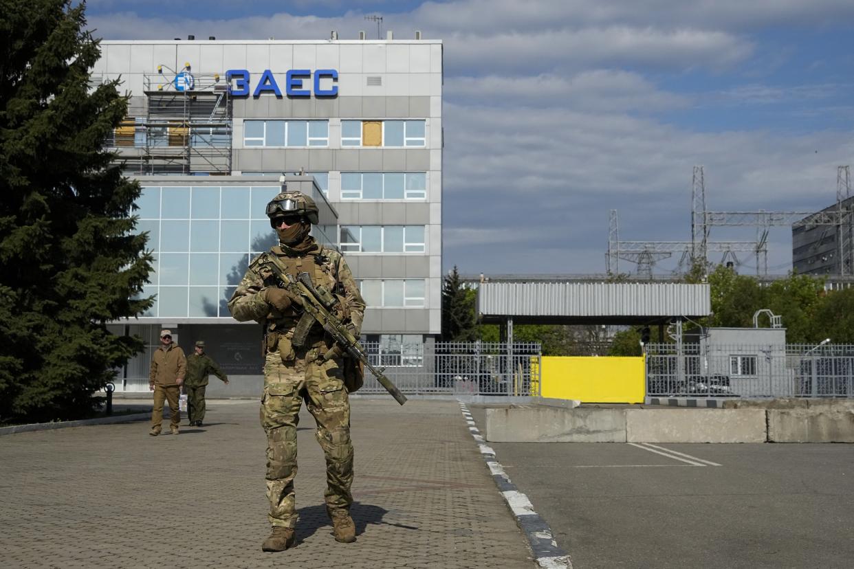 FILE - A Russian serviceman stands guard in an area of the Zaporizhzhia Nuclear Power Station in territory under Russian military control, southeastern Ukraine, on May 1, 2022. The Zaporizhzhia plant is in southern Ukraine, near the town of Enerhodar on the banks of the Dnieper River. It is one of the 10 biggest nuclear plants in the world. Russia and Ukraine have accused each other of shelling Europe's largest nuclear power plant, stoking international fears of a catastrophe on the continent. This photo was taken during a trip organized by the Russian Ministry of Defense. (AP Photo, File)