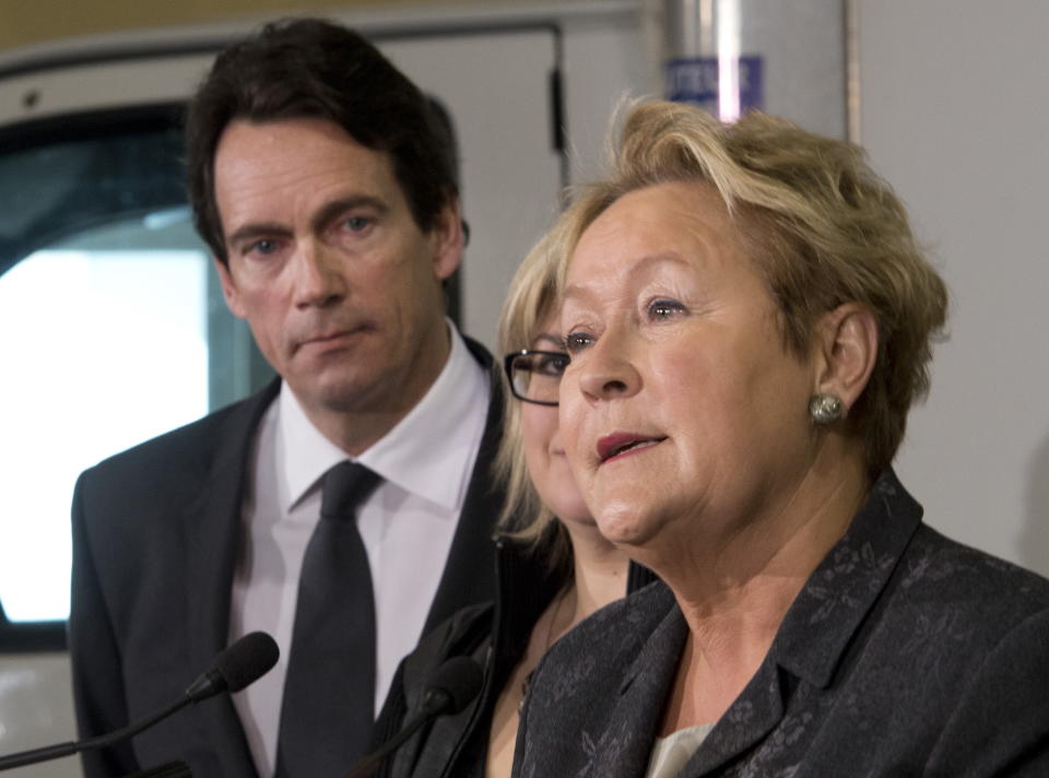 Parti Quebecois Leader Pauline Marois speaks at a news conference, while candidate Pierre Karl Peladeau, left, looks on, Thursday, March 13, 2014 in Levis. Quebecers are going to the polls on April 7. (AP Photo/The Canadian Press, Jacques Boissinot)