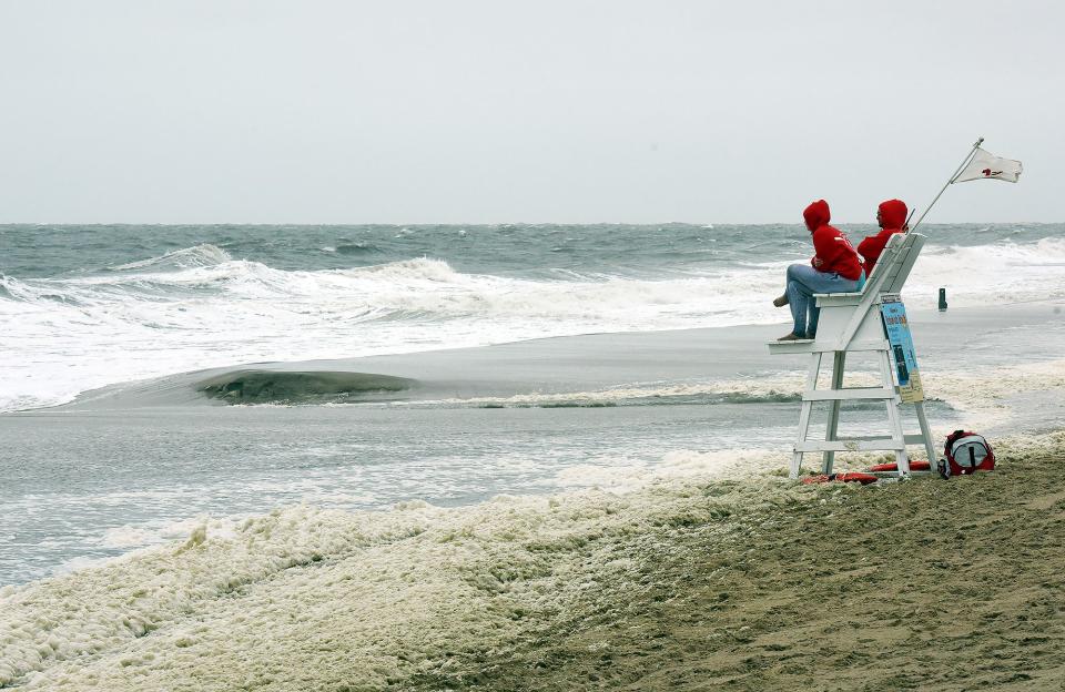 Rehoboth Lifeguards watch the beach as rain and wind along with a gale warning welcomed visitors to Rehoboth Beach for Memorial Day weekend.