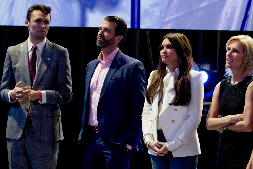 From left, Turning Point USA Founder Charlie Kirk; Donald Trump Jr., the son of President Donald Trump; Kimberly Guilfoyle and radio personality Laura Ingraham watch Donald Trump speak in West Palm Beach, Fla., Saturday, Dec. 21, 2019. 