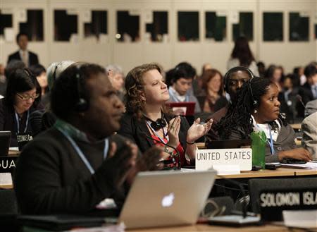 Delegates attend the closing session of the 19th conference of the United Nations Framework Convention on Climate Change (COP19) in Warsaw November 22, 2013. REUTERS/Kacper Pempel