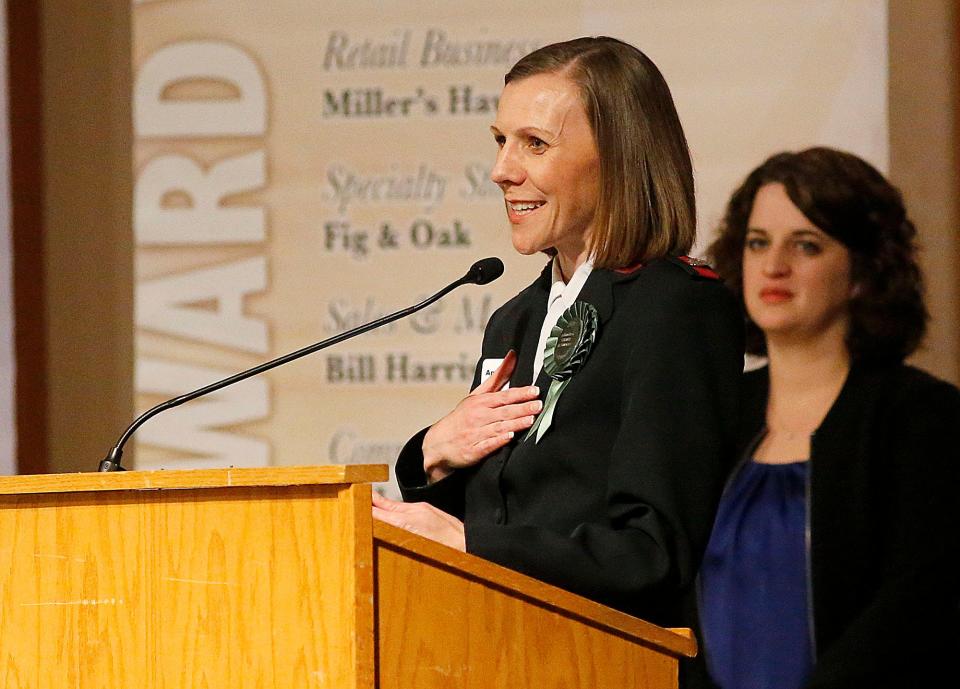 The Salvation Army Kroc Center's Major Annalise Francis speaks after winning the hospitality and recreation services award at the 2023 Ashland Area Chamber of Commerce annual member awards dinner Thursday, March 9, 2023 at Ashland University's John C. Myers Convocation Center. TOM E. PUSKAR/ASHLAND TIMES-GAZETTE