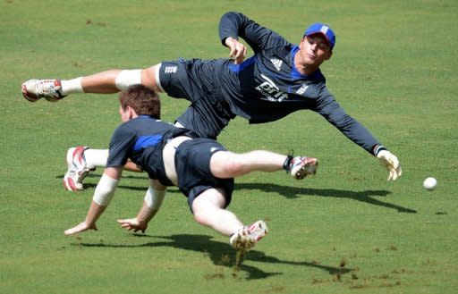 England's Jos Buttler (top) and Eoin Morgan dive to catch the ball during an ICC Twenty20 Cricket World Cup practice session at the Pallekele International Cricket Stadium in Pallekele, on September 26. The World Twenty20 shifts to a higher gear on Thursday when the hot favourites begin an intriguing race for the semi-finals in the Super Eights round