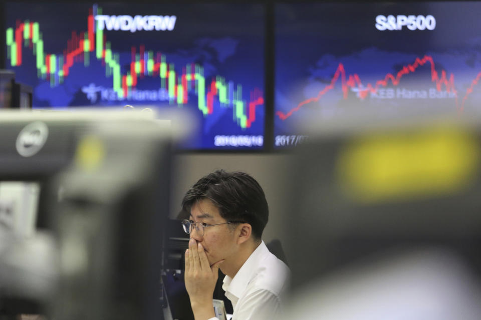 A currency trader watches monitors at the foreign exchange dealing room of the KEB Hana Bank headquarters in Seoul, South Korea, Thursday, July 25, 2019. Asian shares have rallied after the S&P 500 and Nasdaq closed at record highs. South Korea’s Kospi sank early Thursday after North Korea launched two short range missiles into the sea. (AP Photo/Ahn Young-joon)