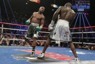 Floyd Mayweather (L) dances around Andre Berto during their WBO Welterweight World Title at the MGM Grand Garden Arena in Las Vegas, Nevada on September 12, 2015