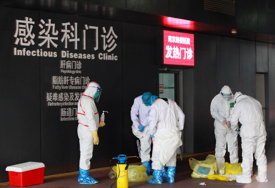 Chinese doctors disinfect for prevention of the new coronavirus and pneumonia before entering the infectious disease and fever clinic at a hospital during the Chinese New Year or Spring Festival holiday in Nanjing City.