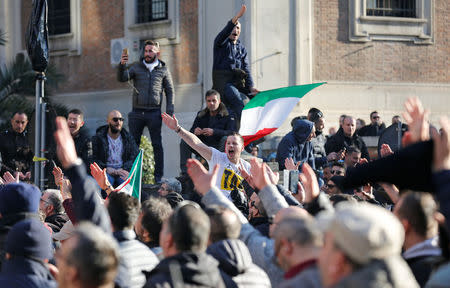 Taxi drivers shout slogans during a rally in Rome, Italy, February 21, 2017. REUTERS/Alessandro Bianchi