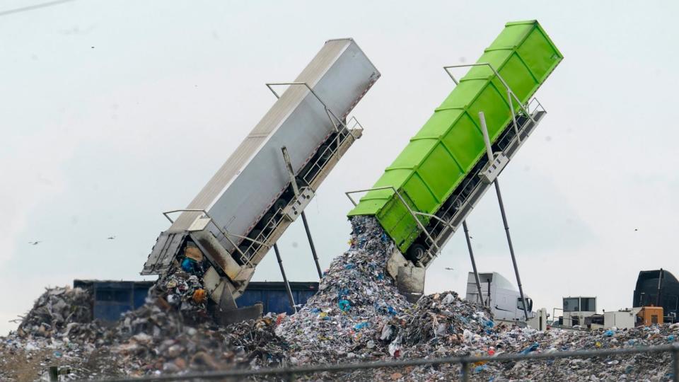 PHOTO: Garbage is loaded into a landfill in Lenox Township, Mich., July 28, 2022. (Paul Sancya/AP)