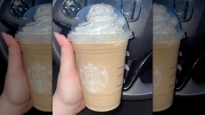 Woman holding Betty White Frappuccino