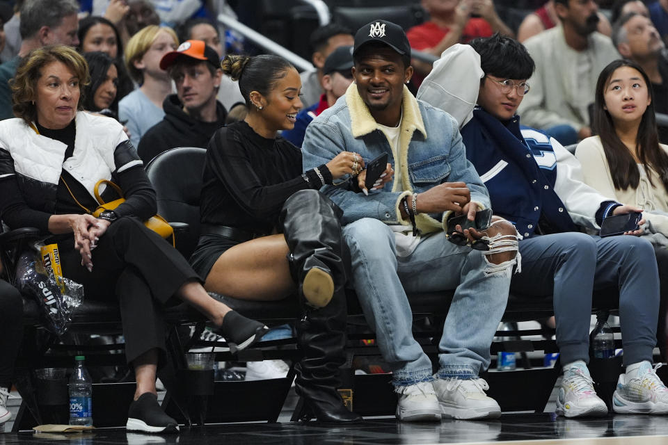 Cleveland Browns quarterback Deshaun Watson watches during the first half of an NBA basketball game between the Los Angeles Clippers and the Cleveland Cavaliers, Sunday, April 7, 2024, in Los Angeles. (AP Photo/Ryan Sun)