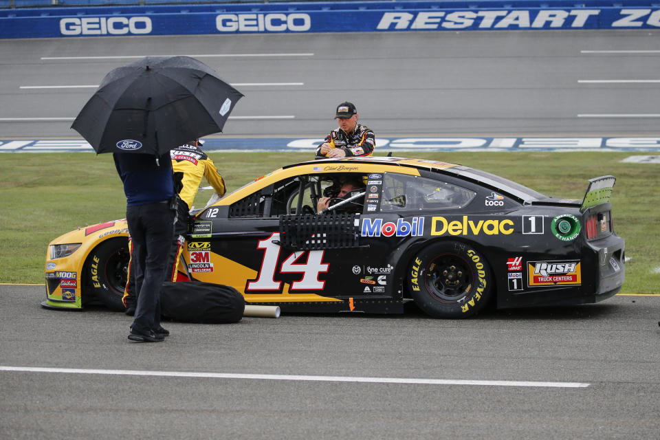 Clint Bowyer (14) sits in his car during a rain delay in a NASCAR Cup Series auto race at Talladega Superspeedway in Talladega, Ala., Sunday, Oct. 13, 2019. (AP Photo/Butch Dill)