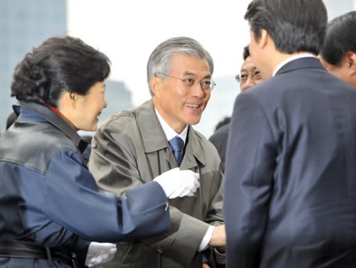 Park Geun-Hye (L) of the rulling Saenuri Party, Moon Jae-In (C) of the Democratic United Party and software mogul Ahn Cheol-Soo (R) in Seoul on November 6. The sudden withdrawal of Ahn means South Korea's presidential race now begins in earnest, with voters facing a straightforward and familiar liberal-or-conservative choice