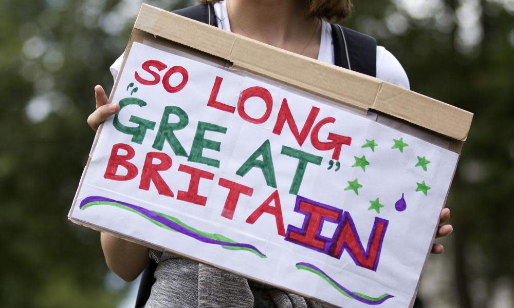 A demonstrator holds a placard that reads 'So Long Great Britain' during an anti-Brexit protest in London.