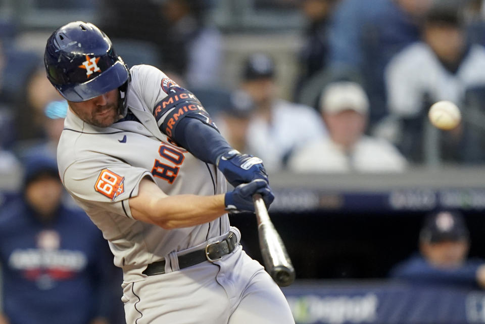 Houston Astros Chas McCormick (20) connects for a two-run home run against the New York Yankees during the second inning of Game 3 of an American League Championship baseball series, Saturday, Oct. 22, 2022, in New York. (AP Photo/John Minchillo)