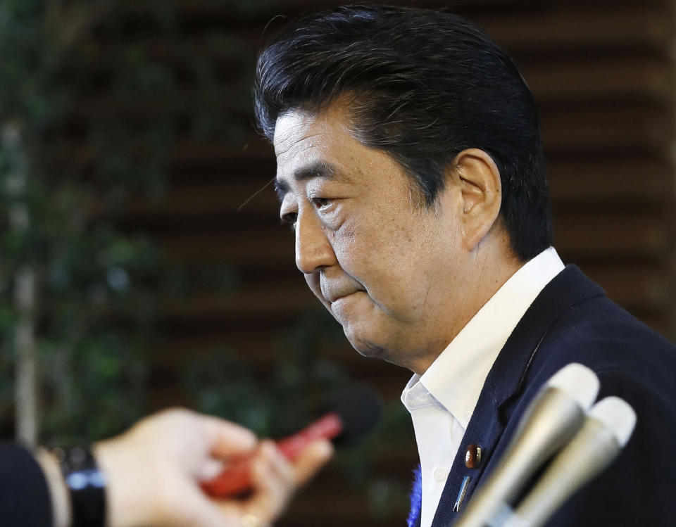 Japanese Prime Minister Shinzo Abe leaves his official residence after announcing that his government will not to appeal against damages ruling in leprosy suit, in Tokyo Tuesday, July 9, 2019. Japan says it will not challenge the recent court ruling awarding damages to former leprosy patients' families for their suffering from discrimination caused by the government's failure to end its isolation policy. (Yohei Kanasashi/Kyodo News via AP)