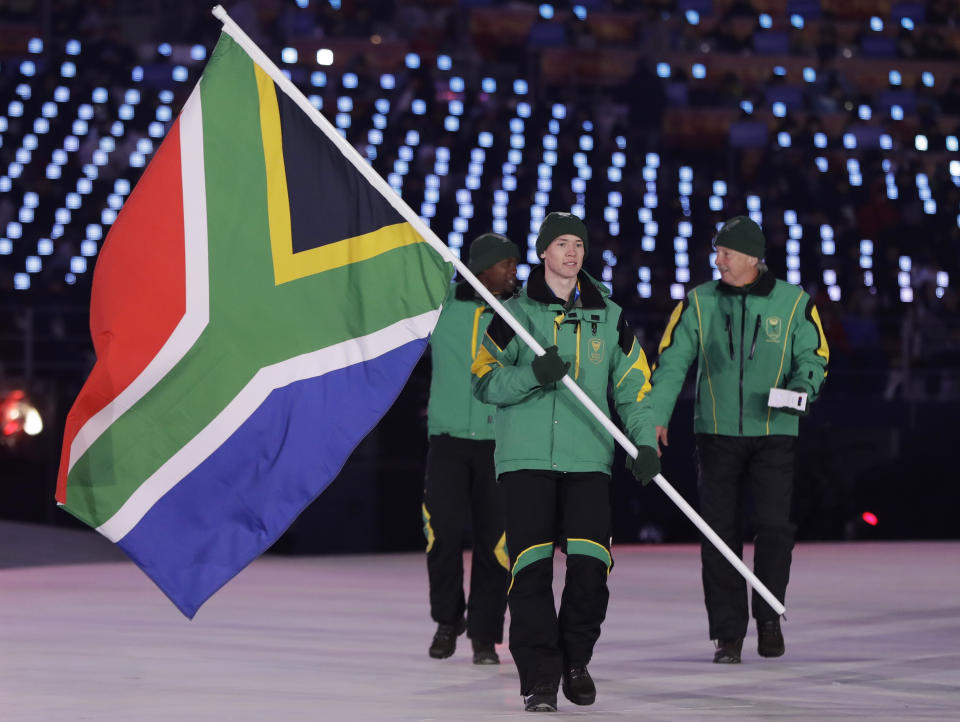 <p>Connor Wilson carries the flag of South Africa during the opening ceremony of the 2018 Winter Olympics in Pyeongchang, South Korea, Friday, Feb. 9, 2018. (AP Photo/Petr David Josek) </p>