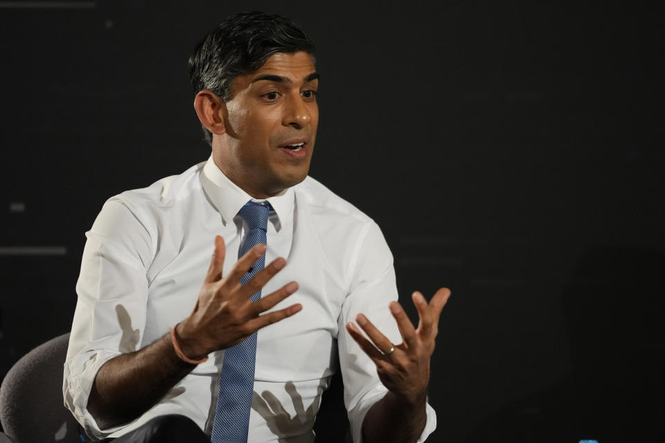 Britain's Prime Minister Rishi Sunak gestures during an in-conversation event with Tesla and SpaceX's CEO Elon Musk in London, Thursday, Nov. 2, 2023. Sunak discussed AI with Elon Musk in a conversation that is played on the social network X, which Musk owns.(AP Photo/Kirsty Wigglesworth, Pool)