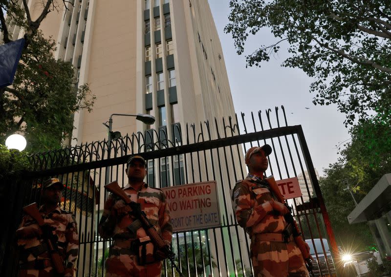 Members of the Indo-Tibetan Border Police stand guard outside a building housing BBC offices, in New Delhi