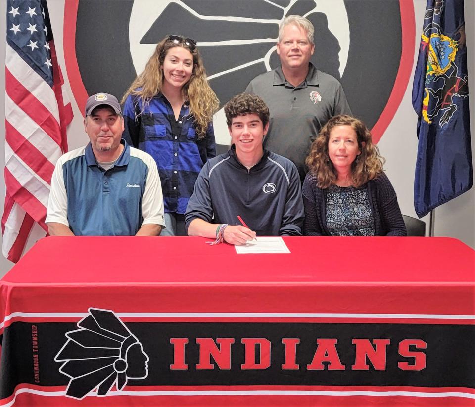 Flanked by parents Jason and Gretchen Ankeny, Conemaugh Township senior Jack Ankeny announces his intentions to golf at Penn State Altoona, May 23, in Davidsville. In back, Ankeny's sister Madalyn Ankeny and Conemaugh Township golf coach Adam Thomas.