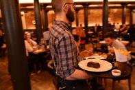 Staff work at Hawksmoor, on the opening day of "Eat Out to Help Out" scheme in London