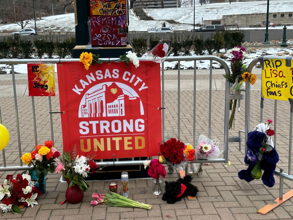 Flowers, signs and other items sit in front of Union Station in Kansas City, Mo., on Feb. 16. The memorial is for the victims of a shooting after a Kansas City Chiefs Super Bowl victory parade Feb. 14.