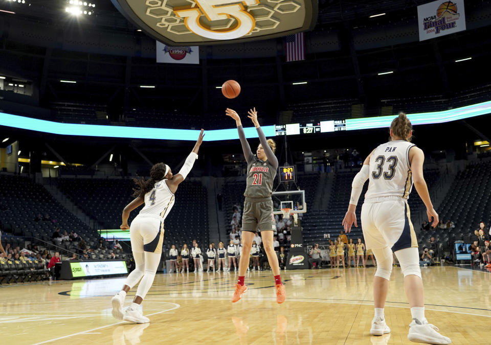 Louisville forward Kylee Shook (21) shoots over Georgia Tech forward Anne Francoise Diouf and guard Francesca Pan during the first half of an NCAA college basketball game Thursday, Feb. 20, 2020, in Atlanta, Ga(AP Photo/Tami Chappell)