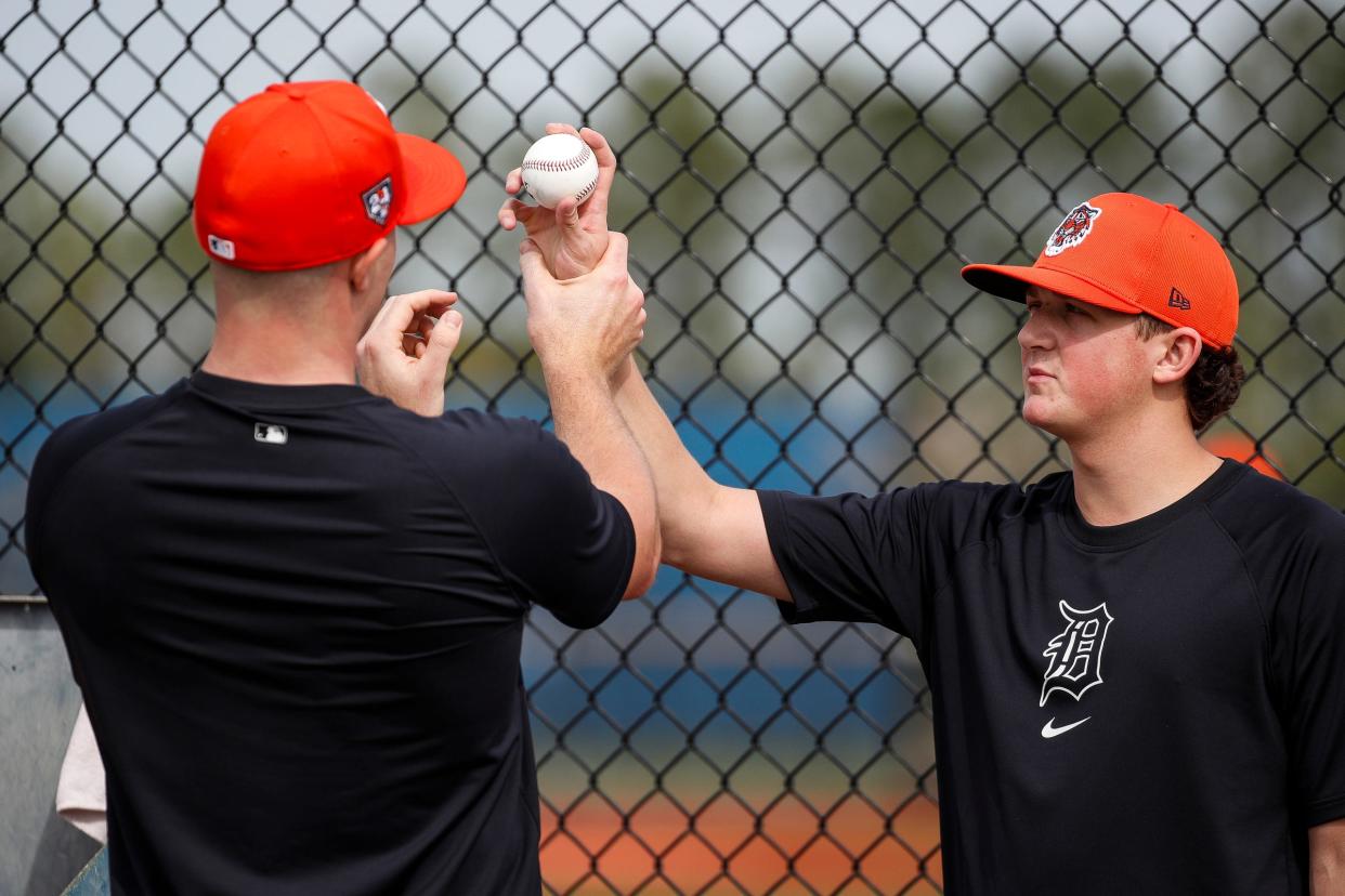 Detroit Tigers pitcher Tarik Skubal talks to pitcher Reese Olson during spring training at TigerTown in Lakeland, Fla. on Friday, Feb. 16, 2024.