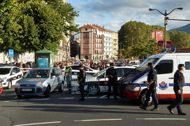 A car drives past a police road block at the beginning of fiestas of Bilbao, after a van ran down pedestrians in Barcelona's Las Ramblas on Thursday, in Bilbao, Spain August 19, 2017. REUTERS/Vincent West