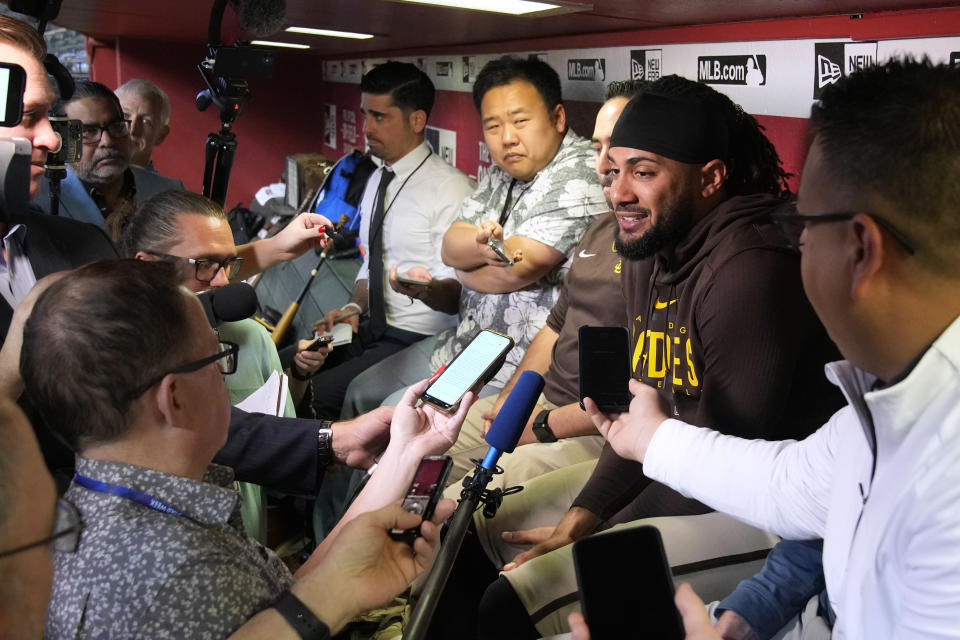 San Diego Padres' Fernando Tatis Jr. talks to reporters before the team's baseball game against the Arizona Diamondbacks, Thursday, April 20, 2023, in Phoenix. (AP Photo/Rick Scuteri)