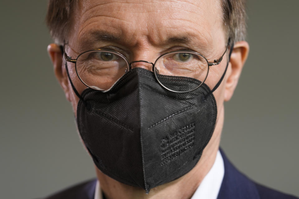 German Health Minister Karl Lauterbach wearing a face mask as he arrives for the weekly cabinet meeting of the German Government at the chancellery in Berlin, Germany, Wednesday, Aug. 24, 2022. (AP Photo/Markus Schreiber)