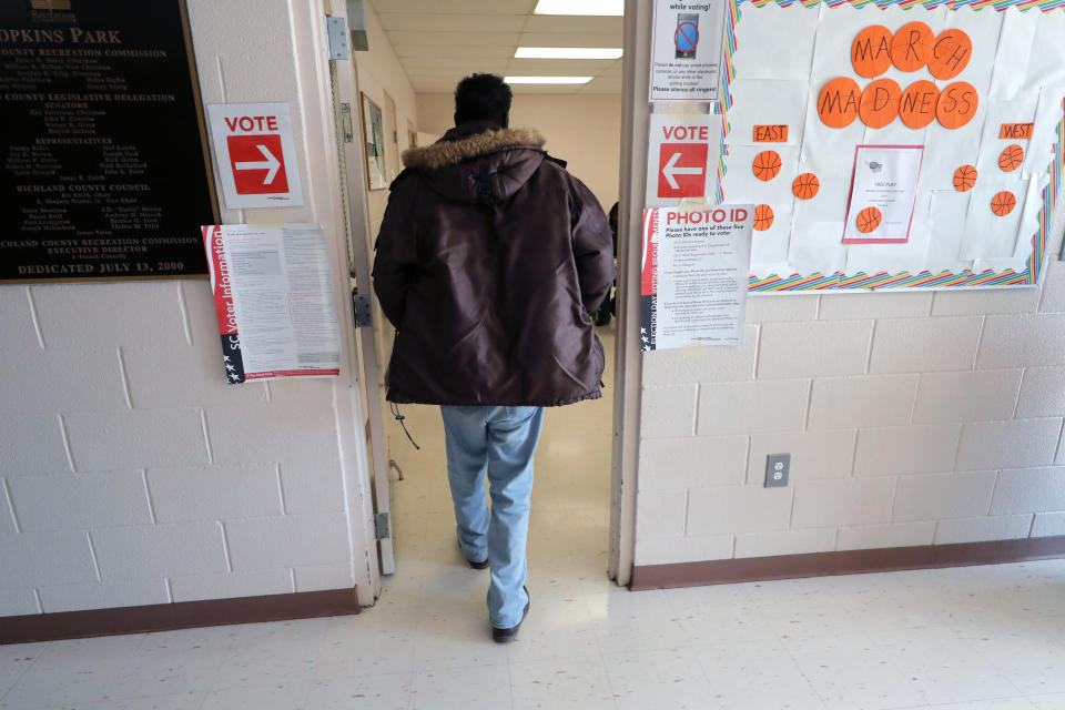 FILE - People arrive to vote in the Democratic presidential primary in Hopkins, S.C., Feb. 29, 2020. The Democratic National Committee’s rulemaking arm voted on a revamped schedule for early votes for the 2024 presidential primary: first South Carolina, followed by New Hampshire and Nevada on the same day, then Georgia and finally Michigan. (AP Photo/Gerald Herbert, File)