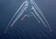 A U.S. Navy MH-60R Sea Hawk helicopter from the "Blue Hawks" of Helicopter Maritime Strike Squadron 78 fires chaff flares during a training exercise near the aircraft carrier USS Carl Vinson (CVN 70) in the Philippine Sea April 24, 2017. U.S. Navy/Mass Communication Specialist 2nd Class Sean M. Castellano/Handout via REUTERS