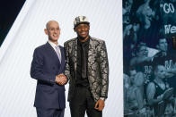 Malaki Branham shakes hands with NBA Commissioner Adam Silver after being selected 20th overall in the NBA basketball draft, by the San Antonio Spurs Thursday, June 23, 2022, in New York. (AP Photo/John Minchillo)