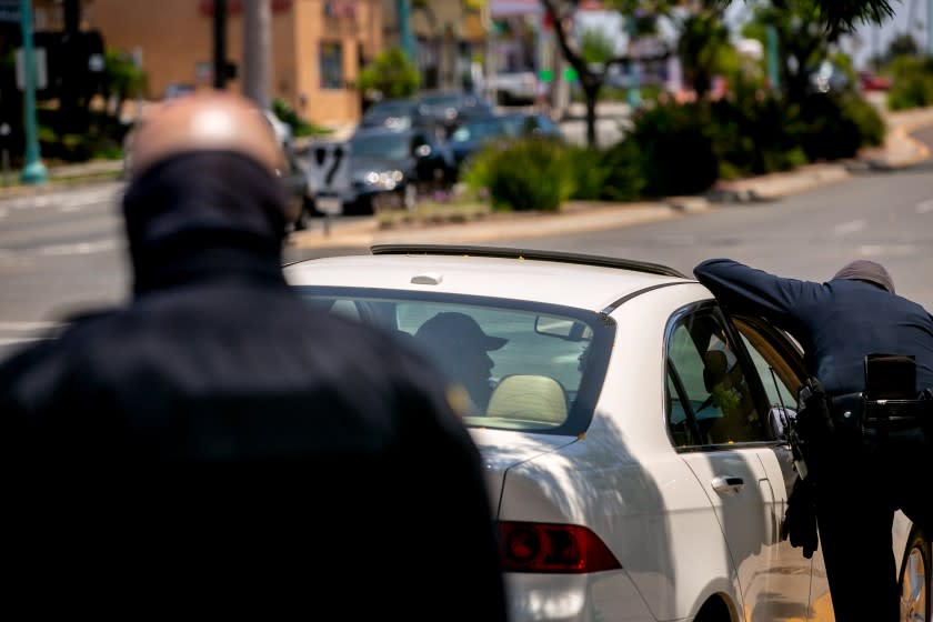 San Diego Police Department officers make a traffic stop along El Cajon Boulevard on June 23, 2020 in San Diego, California.