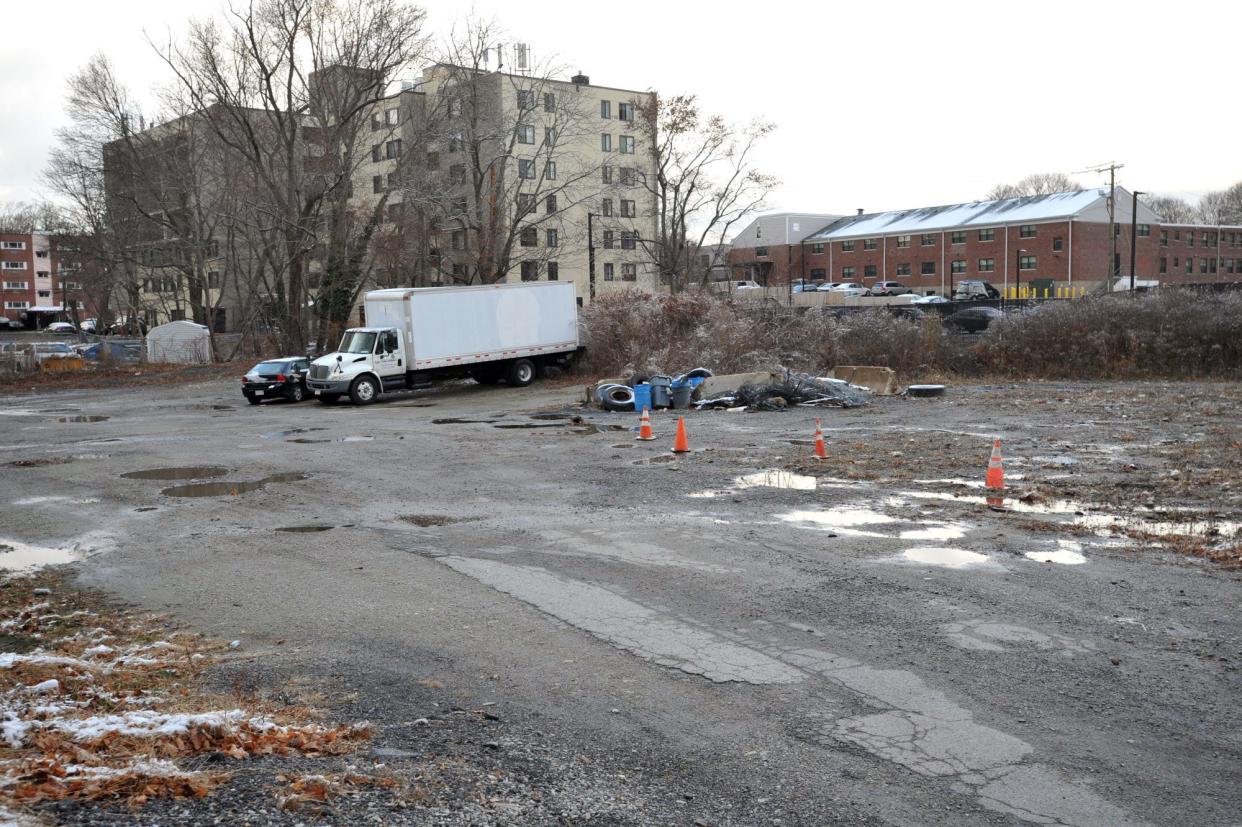 Developers want to build commercial space and apartments at this lot at 238 Washington St. in Weymouth. The lot was strewn with debris and has since been cleaned.