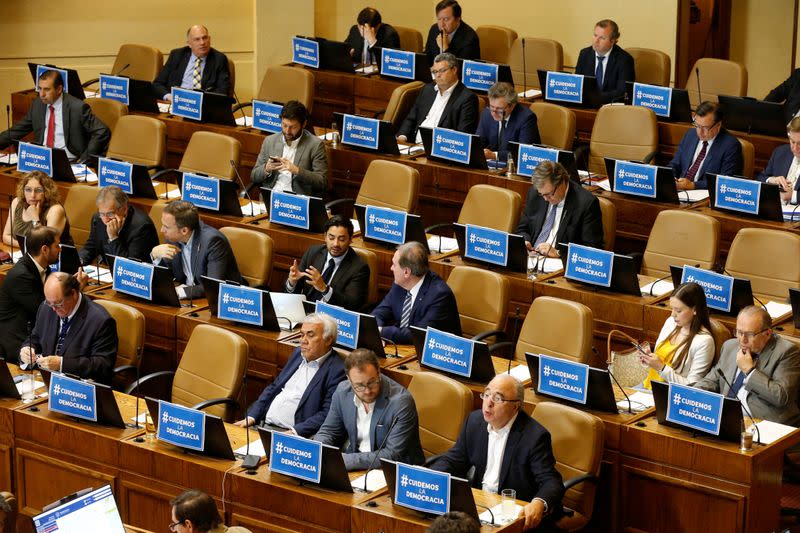 Lawmakers supporting the government debate and vote on an impeachment motion against Chile's President Sebastian Pinera, at a session at the congress in Valparaiso