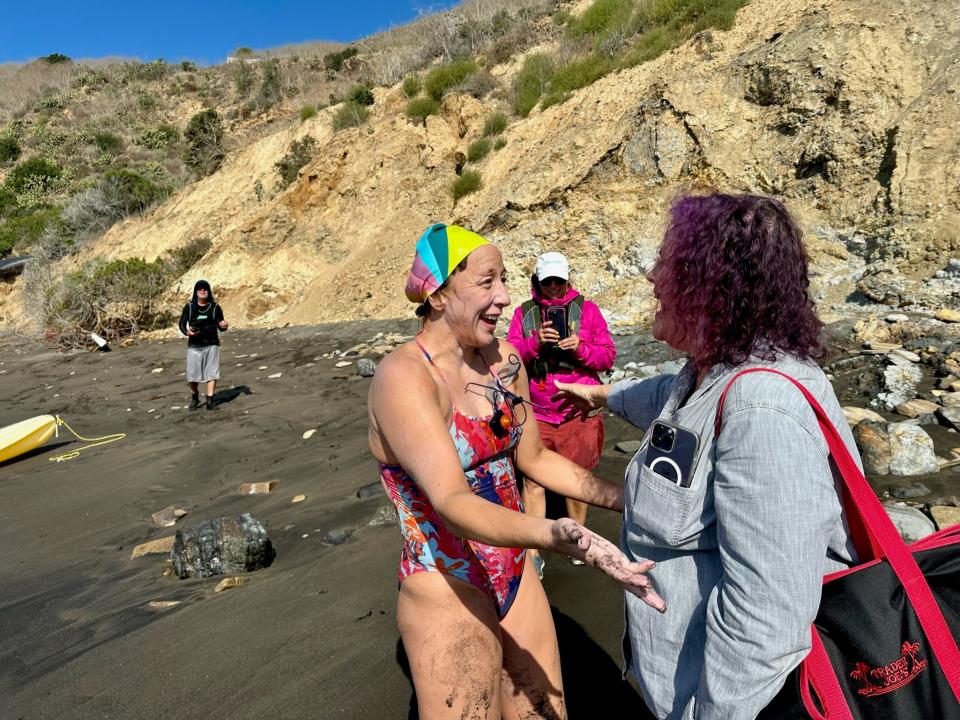 Lura Wilhelm (left) celebrates with her friends Amanda Elliot (center) and Helen Seigel after she finishing her 20-mile swim across the Catalina Channel. The Redding artist and U-Prep teacher made the trip from Catalina Island to Smugglers Cove, near Long Beach, in 11 hours and 16 minutes on Monday morning, Sept. 25, 2023.